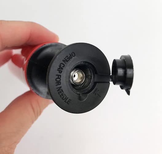 Open cap to get the needle out
