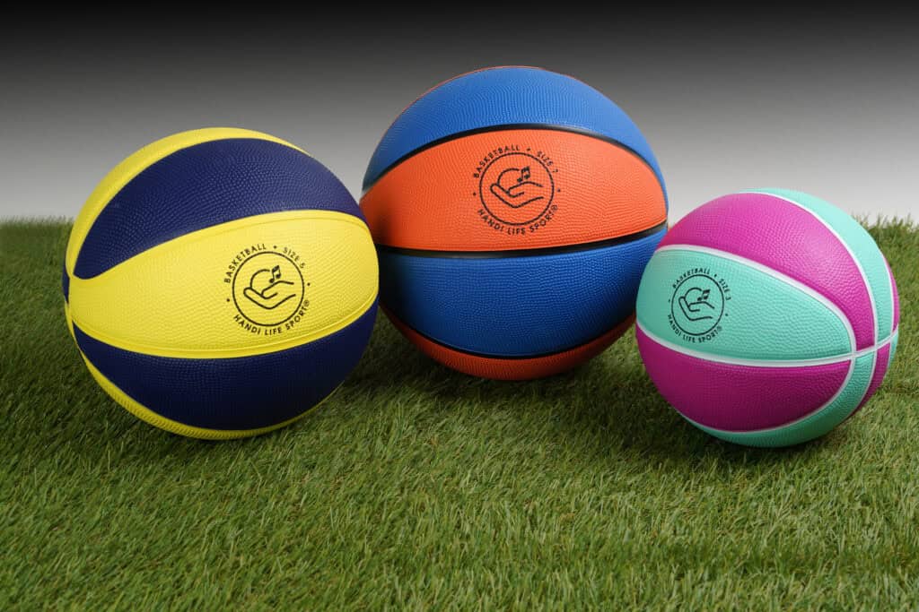 Basketballs on grass - three sizes
